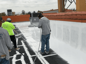 People repairing a roofing system